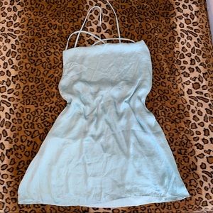 Sage green satin slip dress with an open back